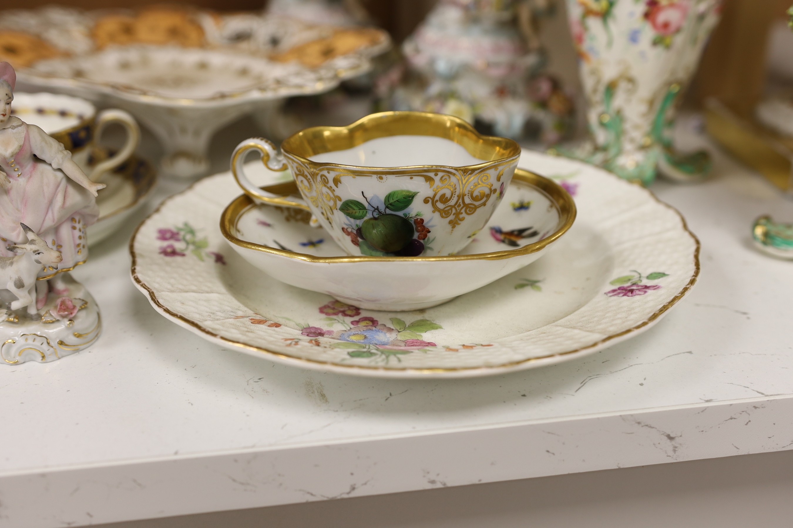 A mixed collection of floral encrusted 19th century and later Continental porcelain